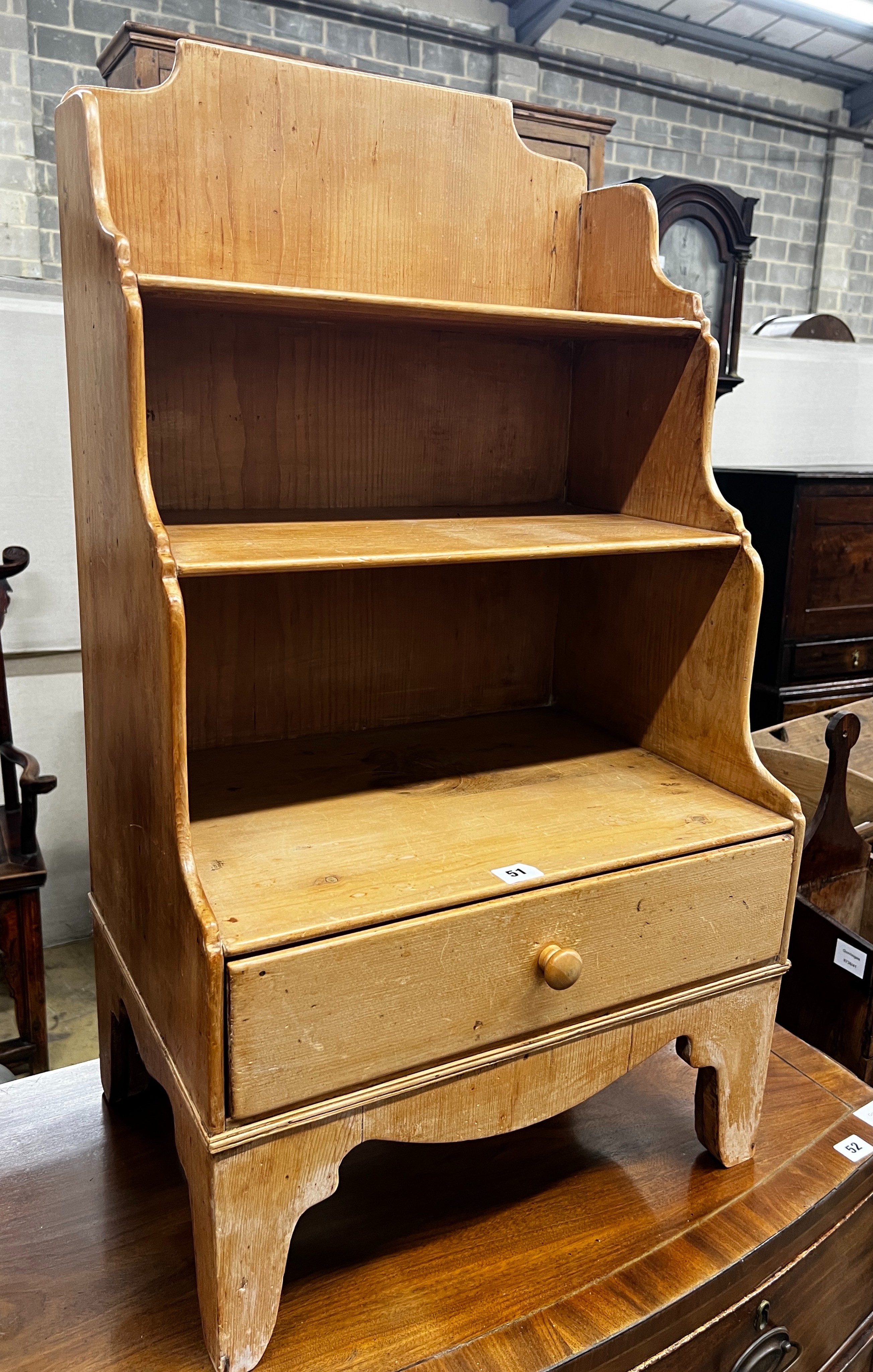 A small 19th centurty pine graduated open bookcase, length 49cm, depth 35cm, height 90cm